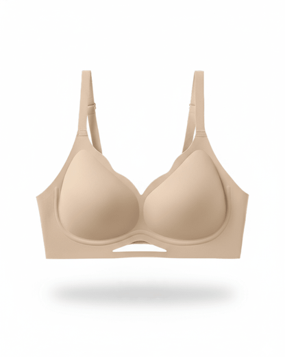 Beige wireless plunge bra with breathable mesh detail and adjustable straps, front view
