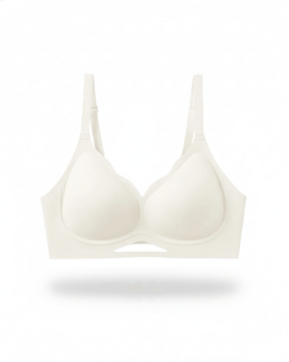 Beige wireless plunge bra with adjustable straps and breathable seamless cups on white background.