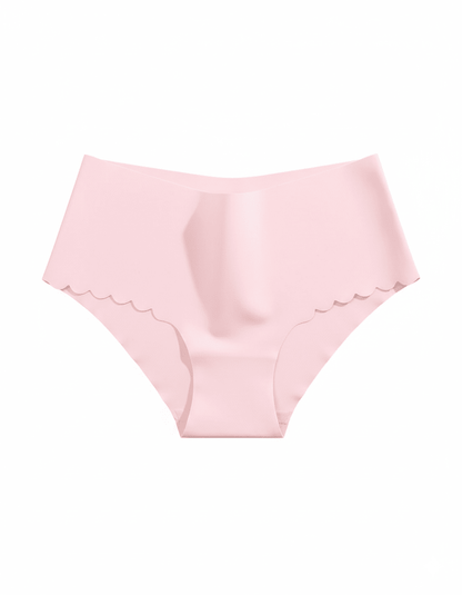 Light pink seamless no show panties with scalloped edges, invisible women's briefs on white background