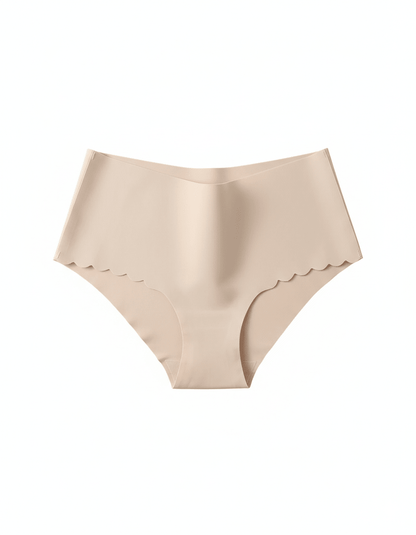 Seamless nude no-show panties with scalloped edges on a white background.